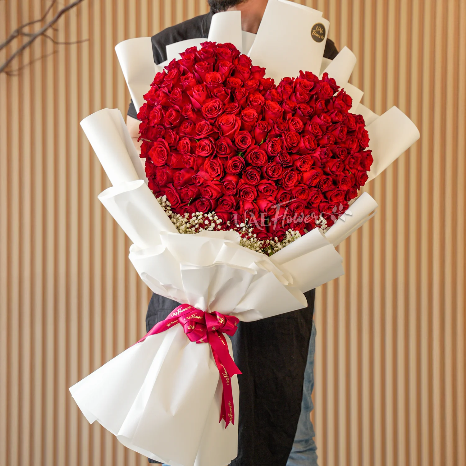 150 red roses with baby’s breath fillers, wrapped in elegant paper