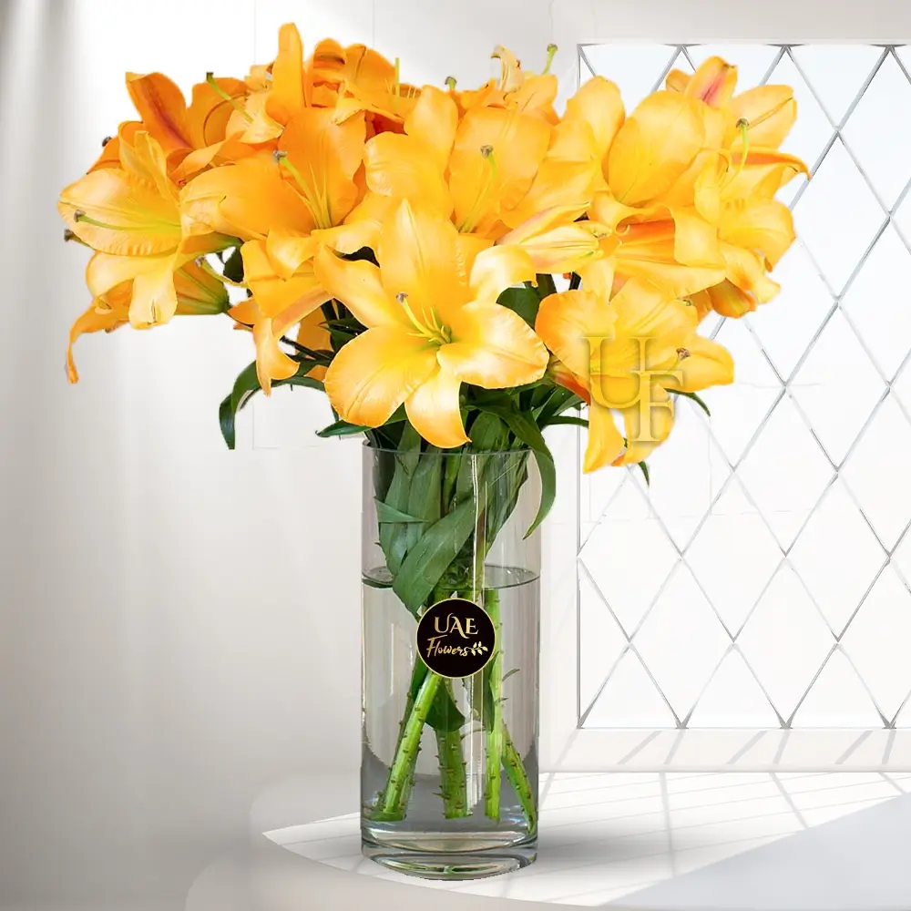 6 Stems of Yellow lilies in a Glass Vase