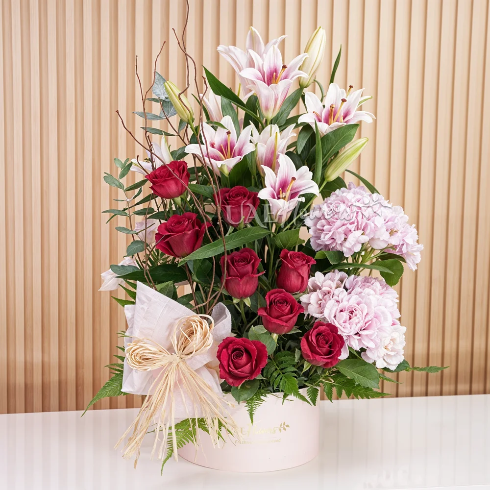 2 pink hydrangeas, 2 pink lilies, and 8 red roses