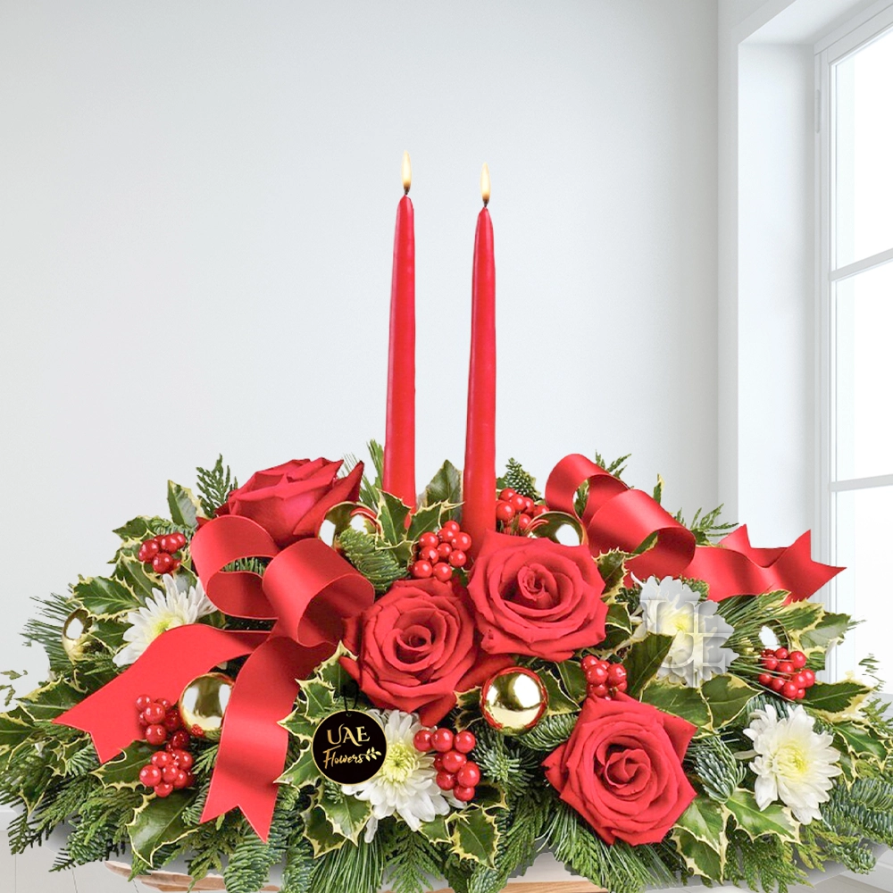 7 red roses, 6 white spray chrysanthemums, variegated holly, noble fir, flat cedar, white pine, red berries, gold ornament balls, red ribbon, and red taper candles