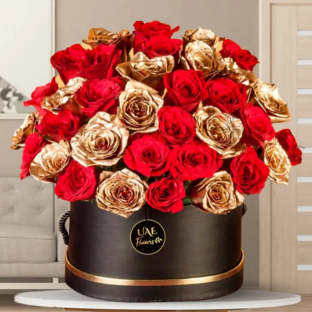 Round black box with 20 red roses and 15 gold-sprayed roses arranged elegantly for luxury gifting