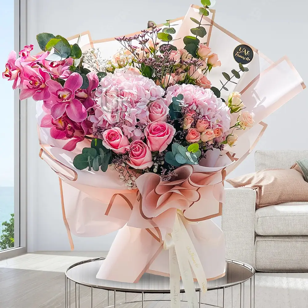 4 pink roses, 6 spray roses, 2 hydrangeas, and 1 cymbidium orchid