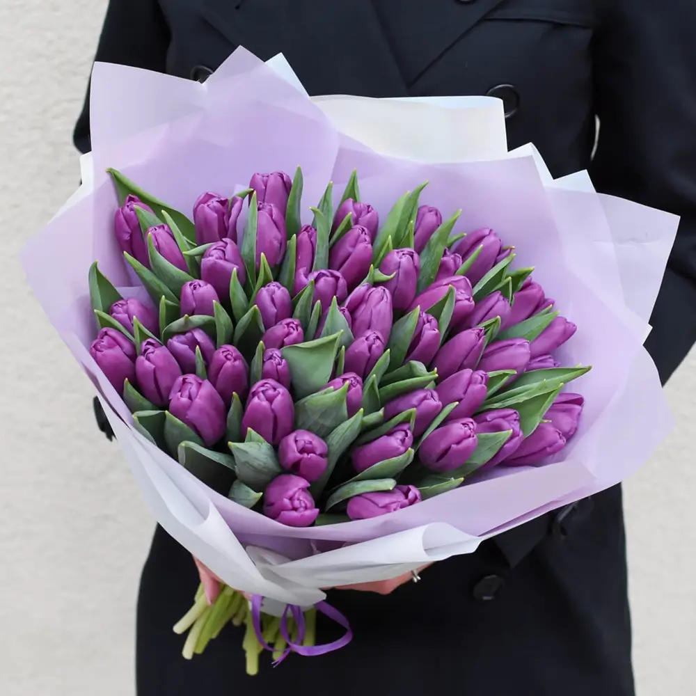 bouquet of 40 purple tulips arranged with basic green fillers