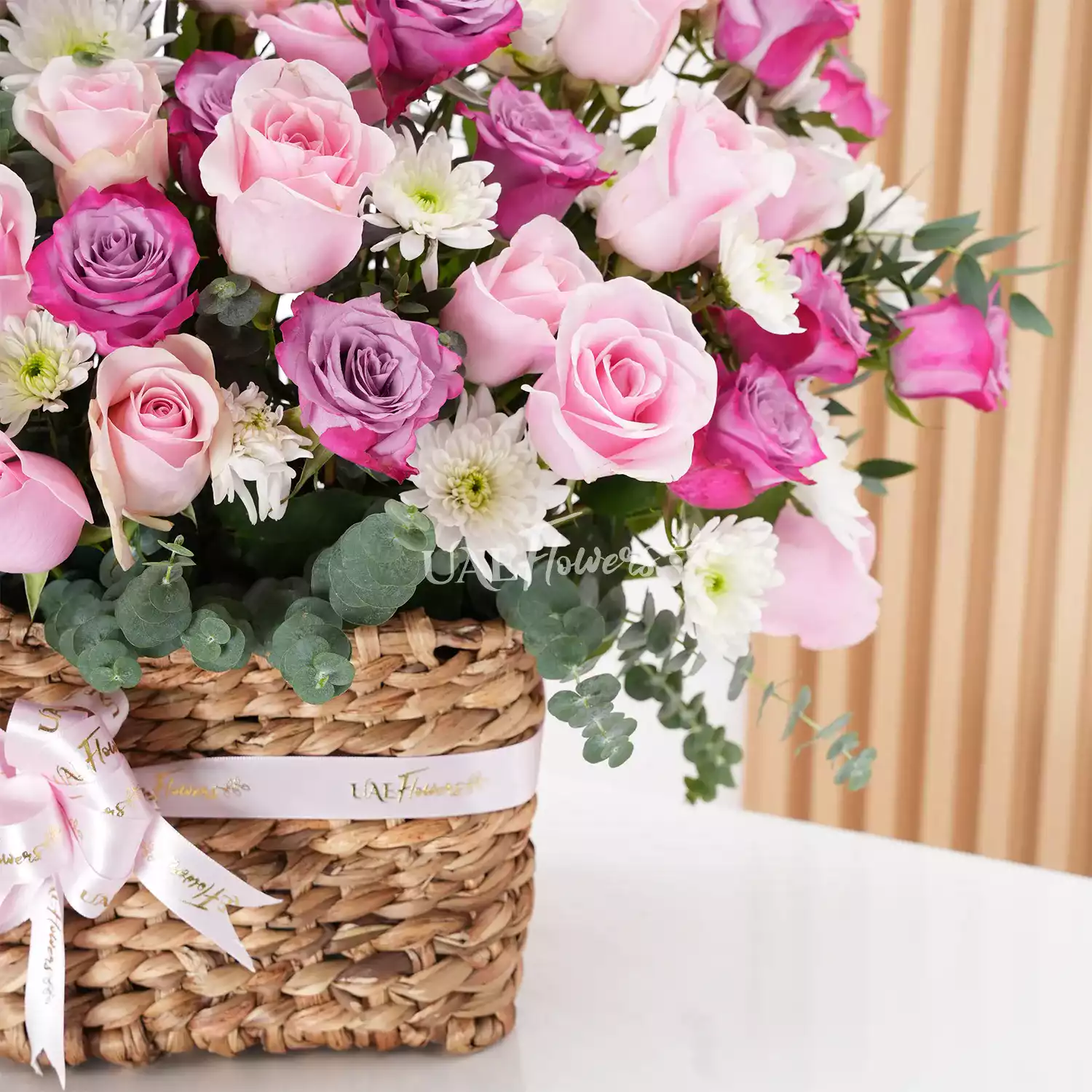 Basket Arrangement featuring 40 purple and pink roses