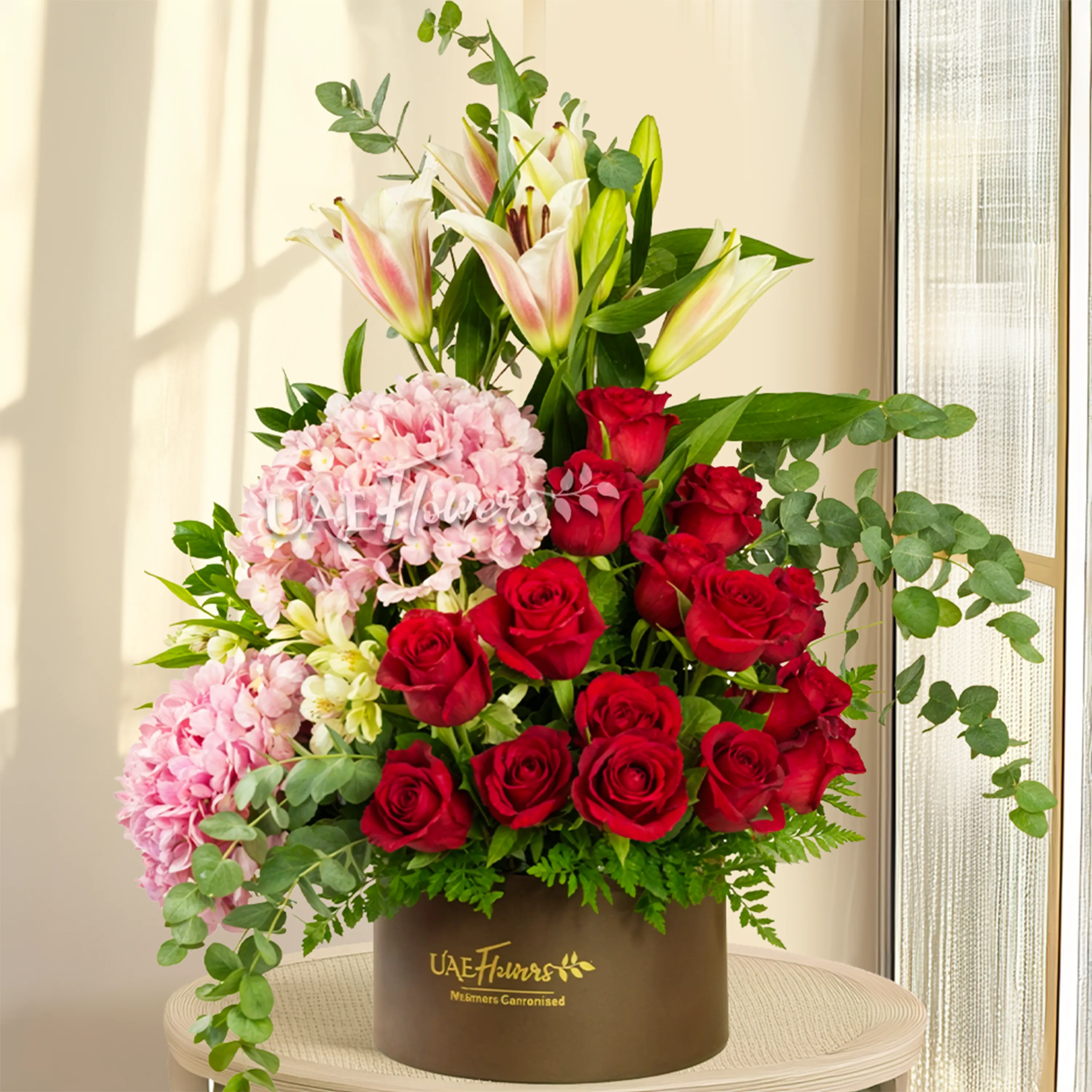 2 pink hydrangeas, 2 pink lilies, 2 white alstroemerias, 15 red roses