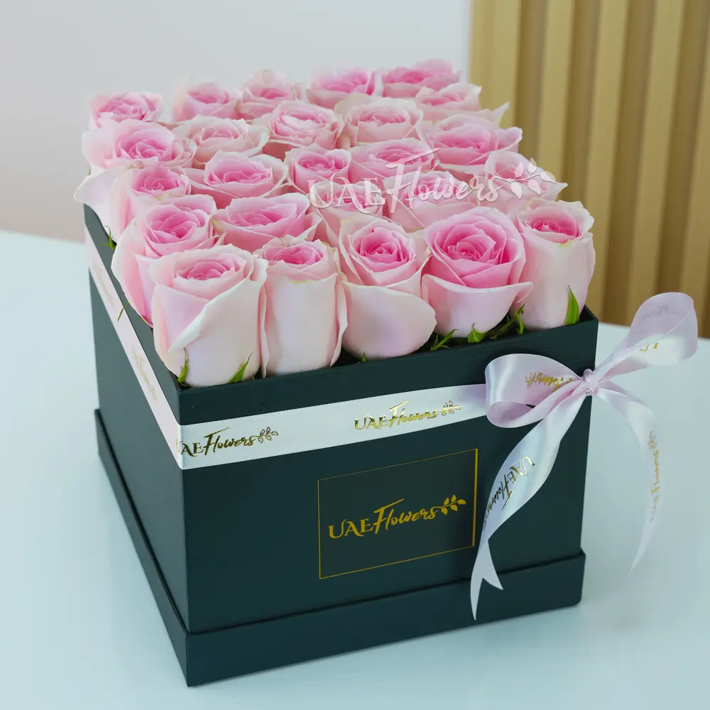 25 pink roses arranged in a square box