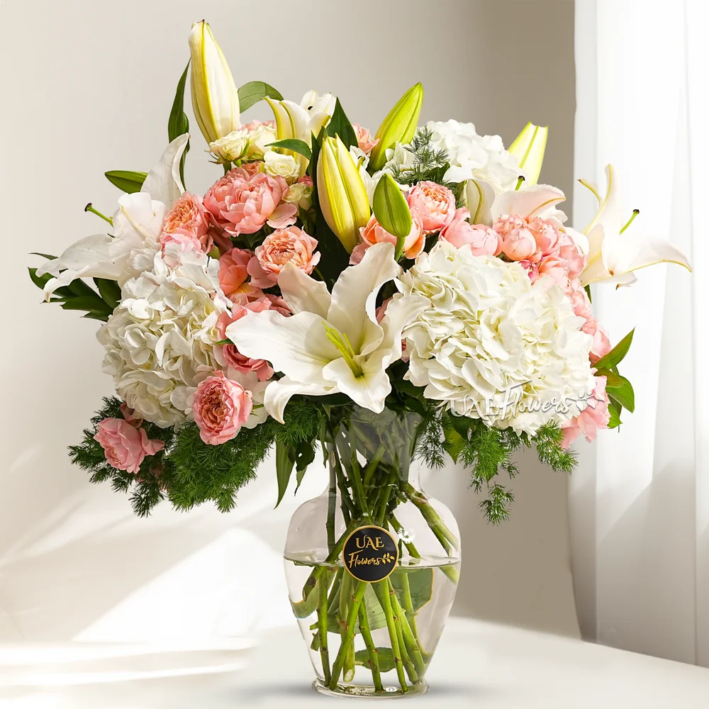 Crysal Ivory bouquet with 3 white hydrangeas, 6 Juliette spray roses, 5 white lilies, and 3 white spray roses