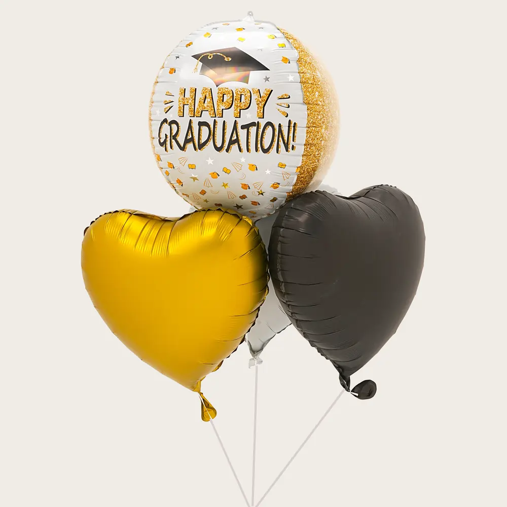 Graduation foil balloon with four heart-shaped foil balloons filled with helium