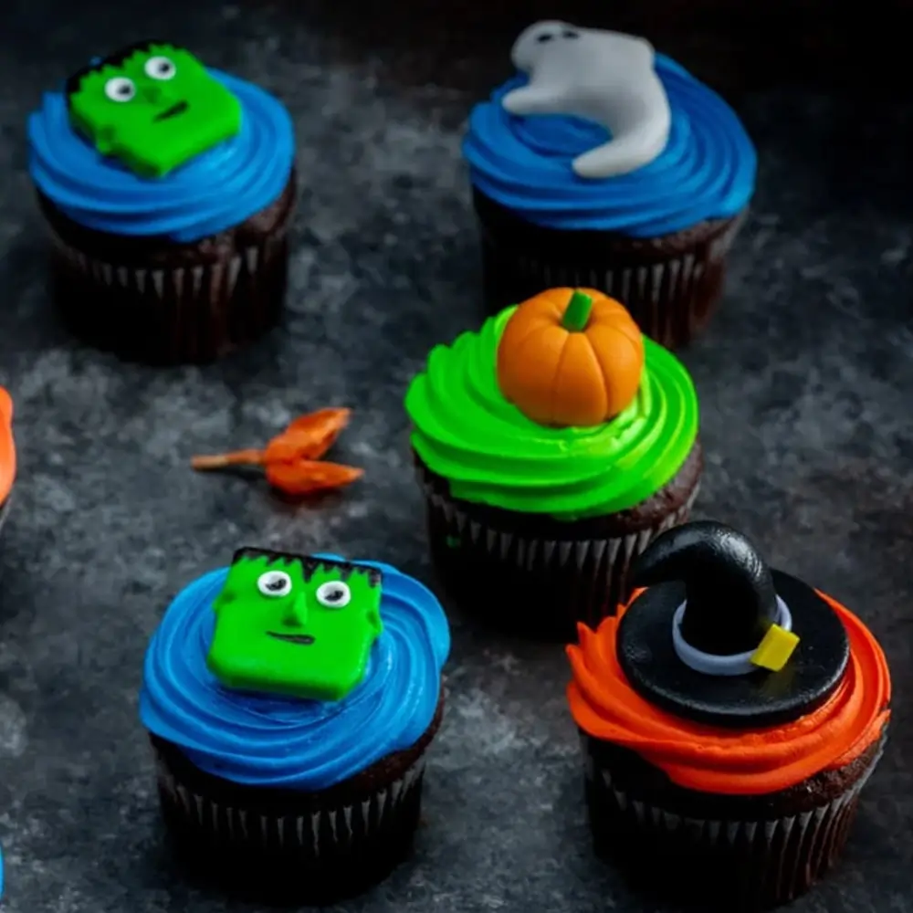 Set of 4 Halloween character cupcakes with spooky designs