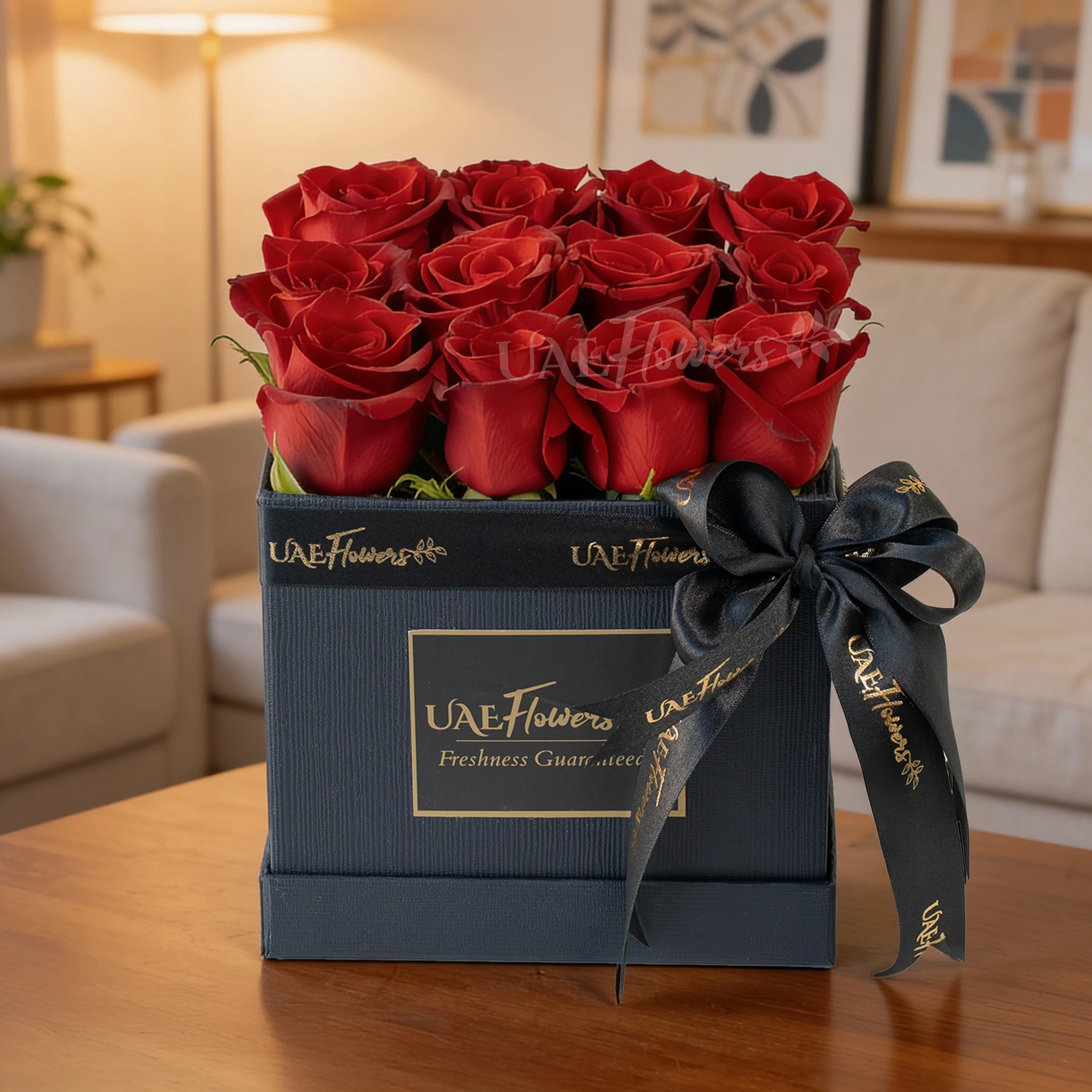 An Arrangement of 12 Red Roses in a Square Black Box
