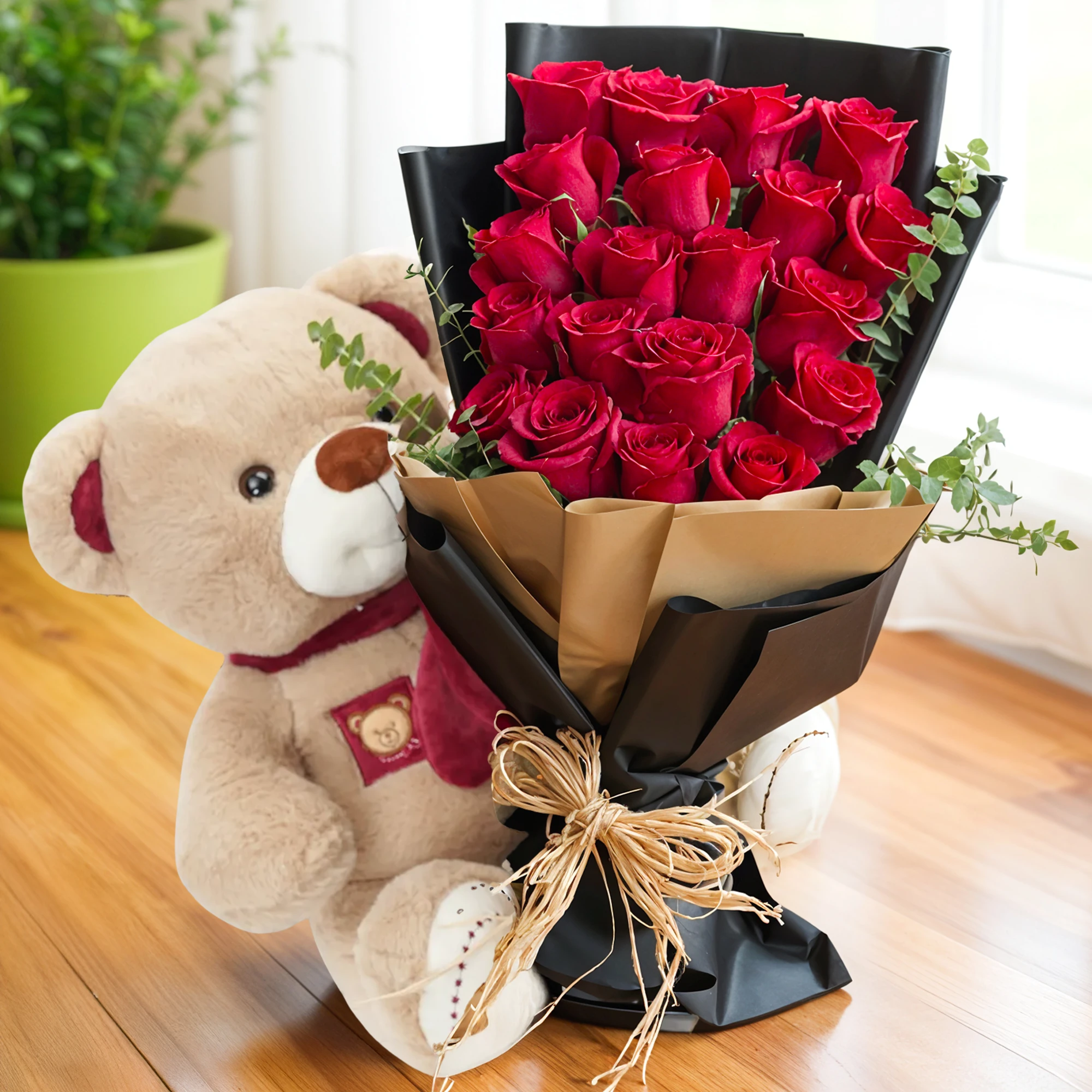 20 red roses with fillers and medium-sized brown teddy.