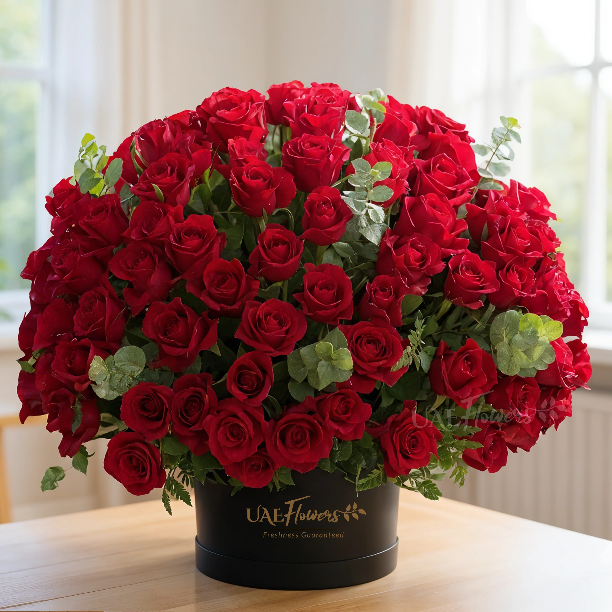 100 red roses box arrangement with eucalyptus in a black box 100 red roses box arrangement with eucalyptus in a black box