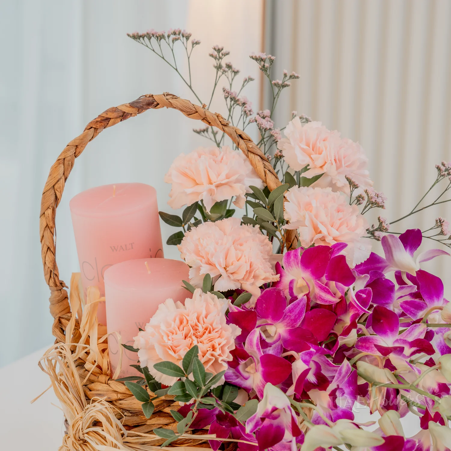 10 purple orchids, 5 pink carnations, 2 pink candles,