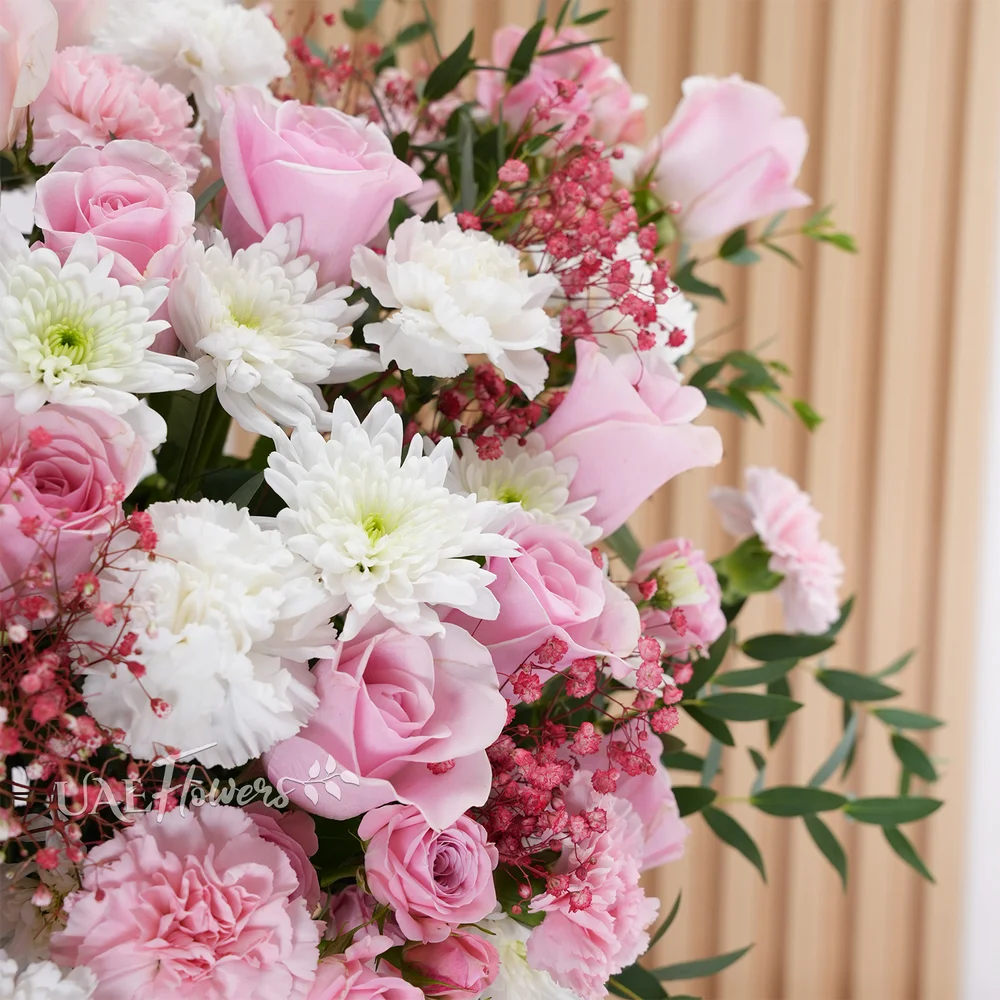 15 pink roses, 12 pink and white carnations, 5 pink spray roses,