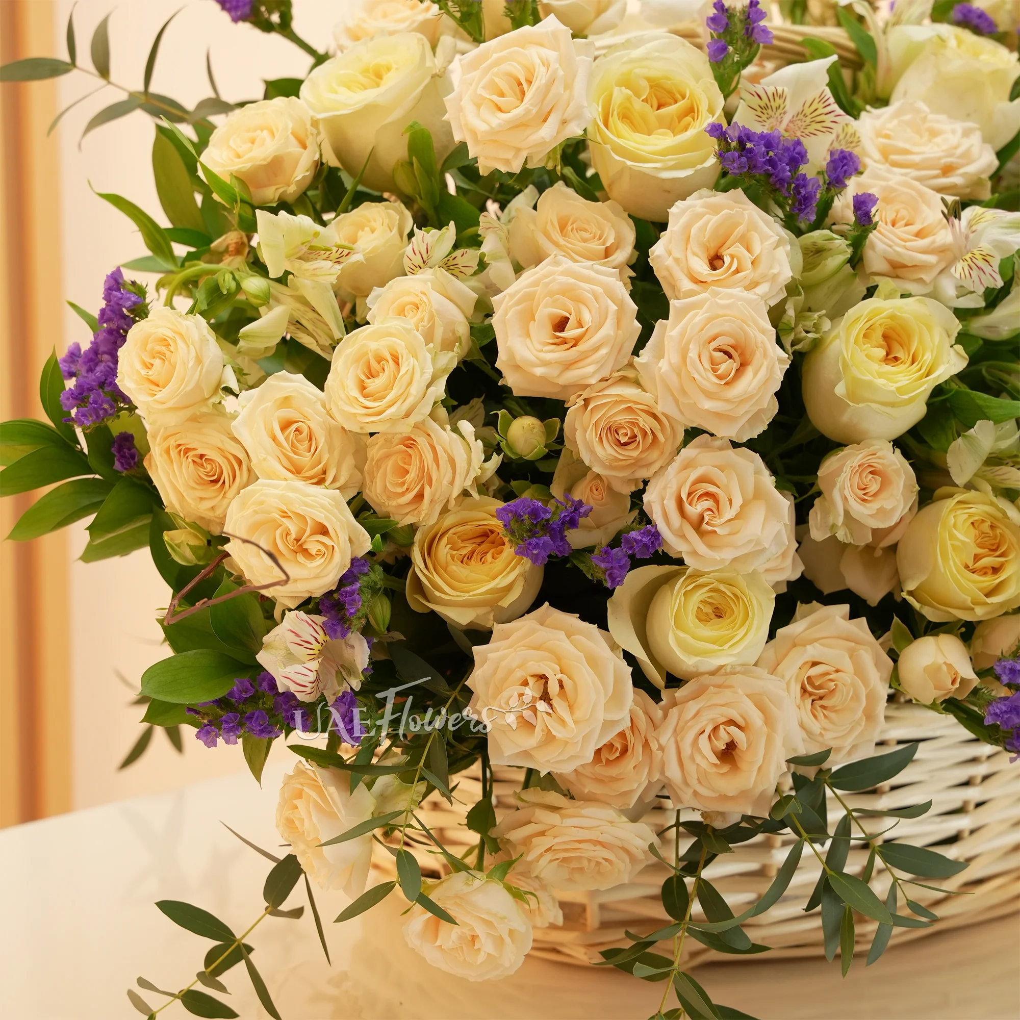 10 peach roses, 10 peach spray roses, 2 sunflowers, and green fillers