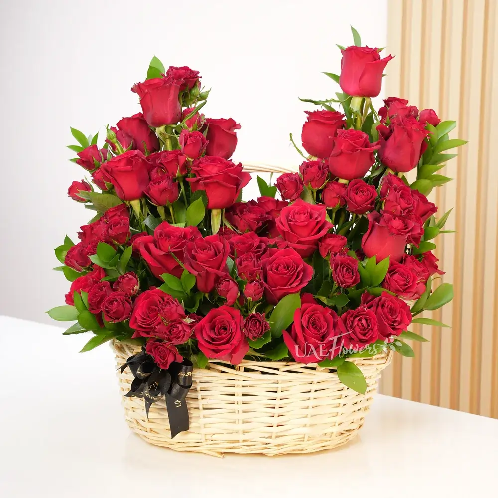 20 red roses and 5 red spray roses with green fillers.
