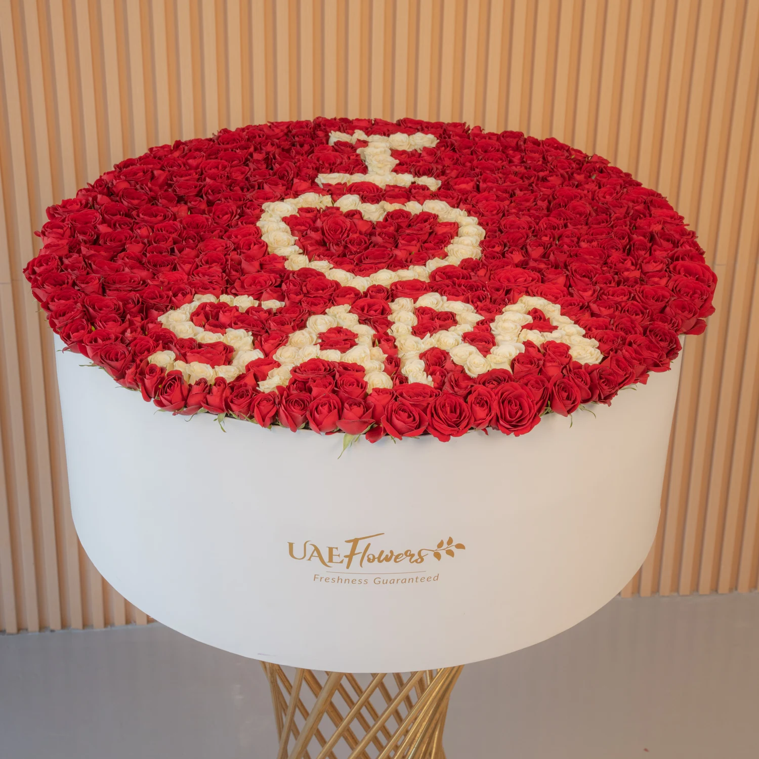 large flower box featuring 500 red rose buds and spray roses