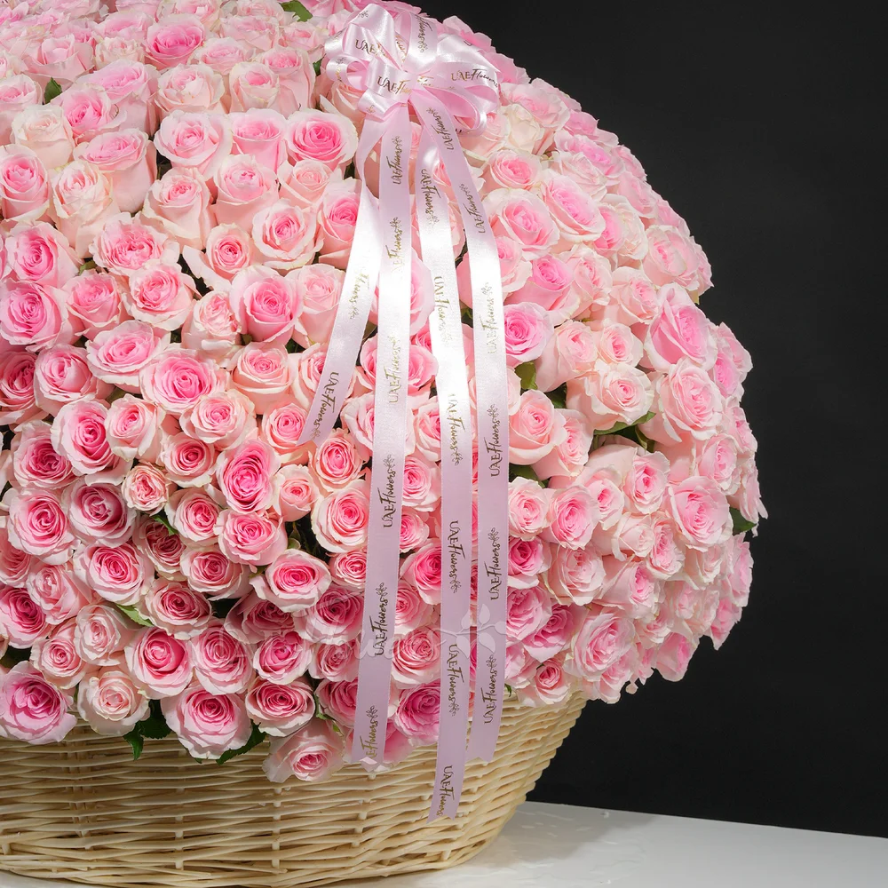 round basket filled with 600 pink roses