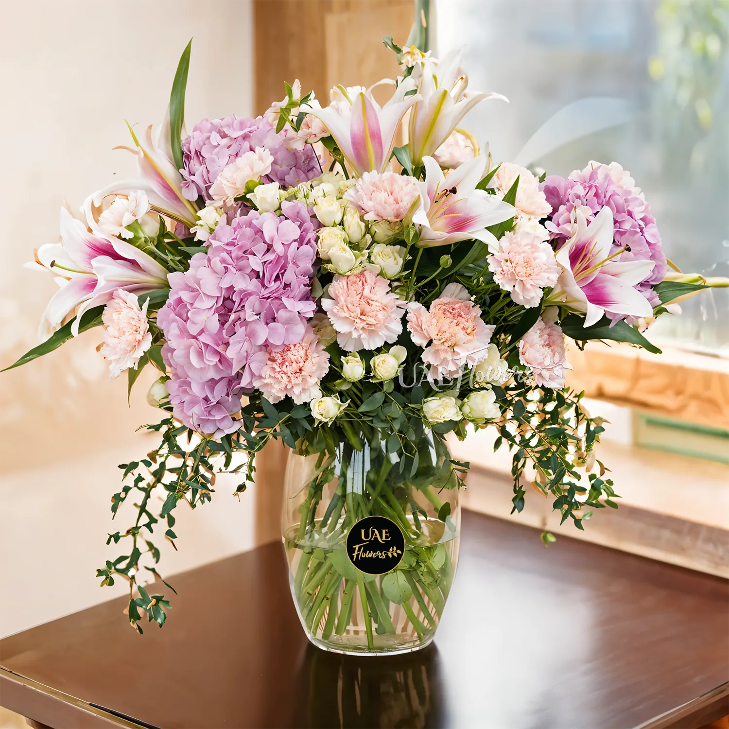 3 pink hydrangeas, 5 pink lilies, 10 pink carnations, and 5 white spray rose